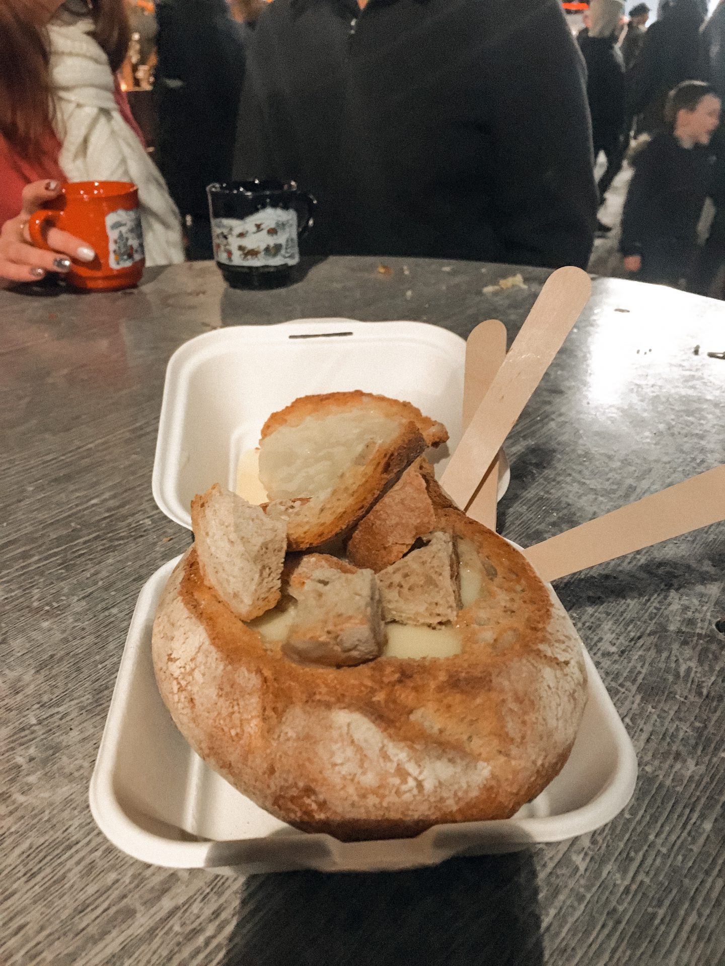 Cheese in a bread bowl - food as Edinburgh Christmas market