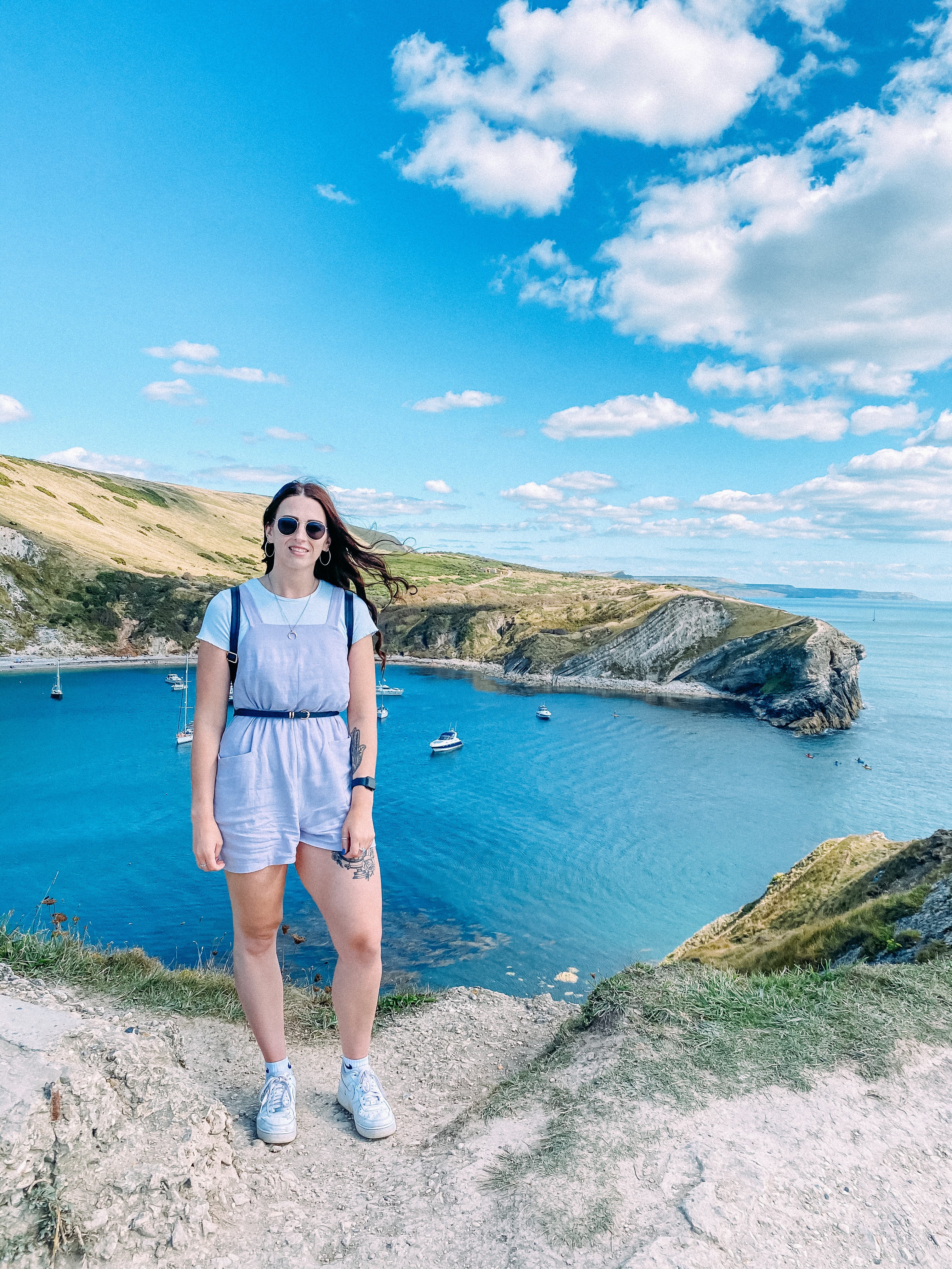 Lulworth cove, dorset in the summer with blue skies