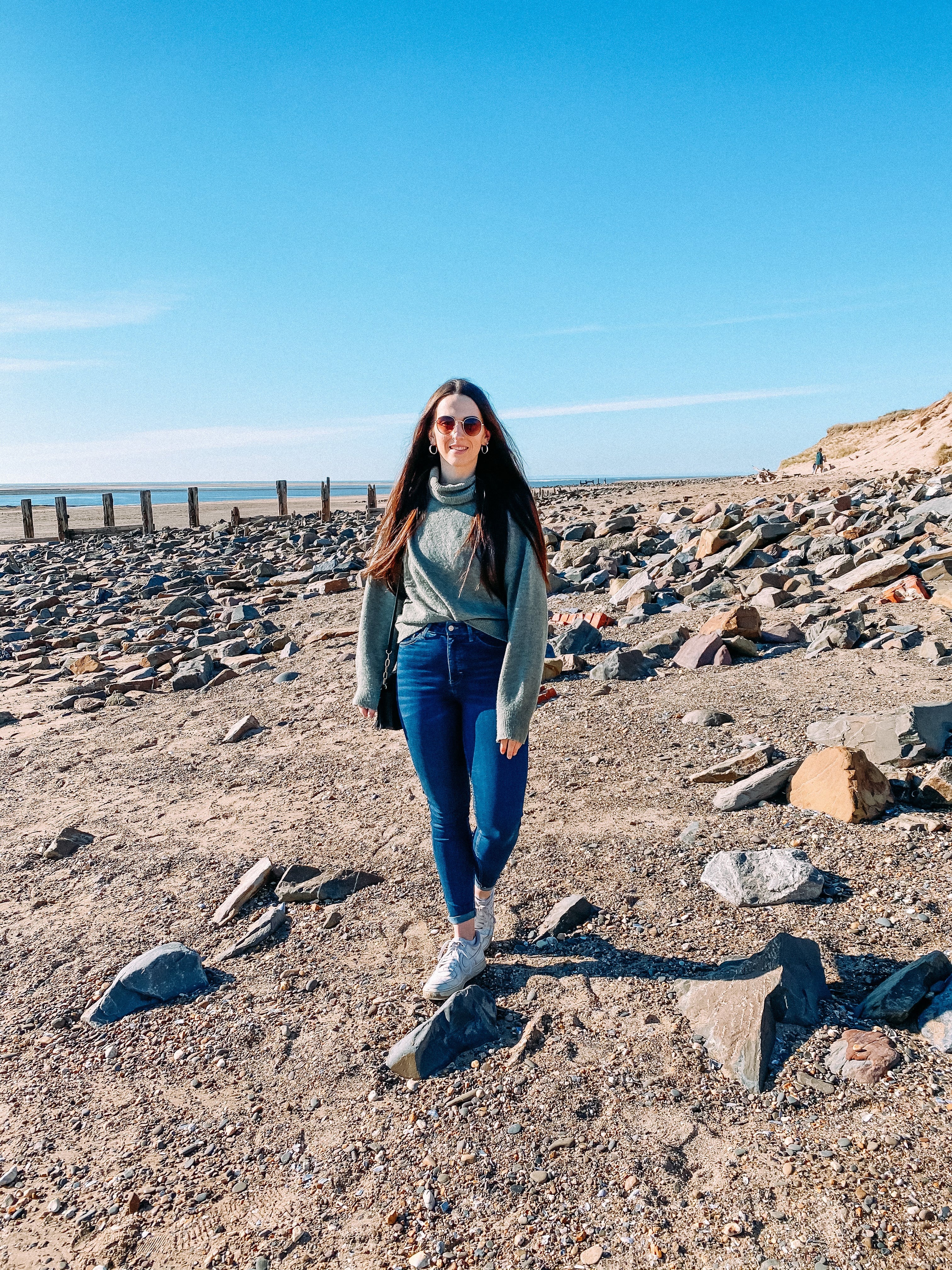 Girl on Crow Point beach in North Devon